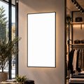 Professional LED lightbox – Black / Large Format XXL (120 × 75 cm) with an unprinted white panel in a commercial interior